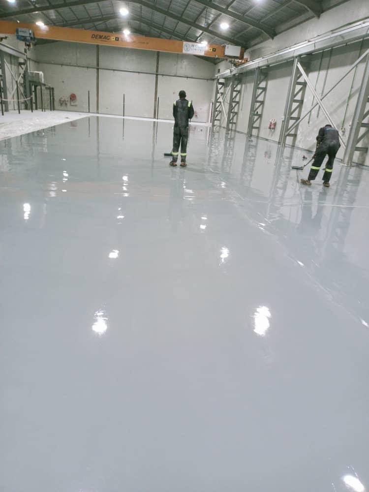 Give your floors a new life with our durable, glossy, and customizable epoxy coating services!